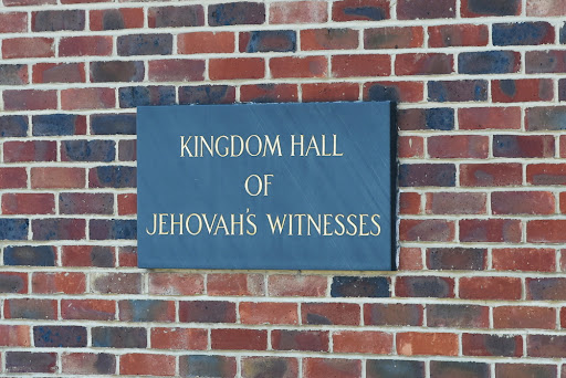 Sign on outside wall of Kingdom Hall of Jehovah's Witnesses